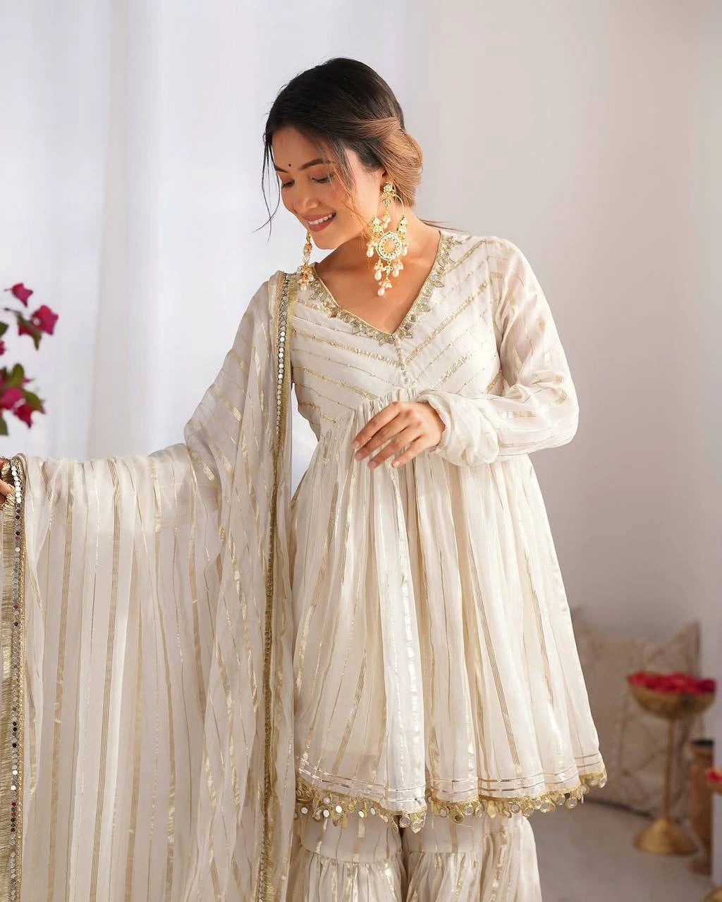 Woman in a traditional outfit with a white background